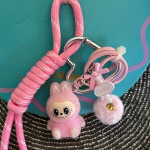 Cute Lulla Collection Bag Charm Pink with Pom-Pom Accent